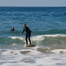 Hannah up on the surf board in San Deigo